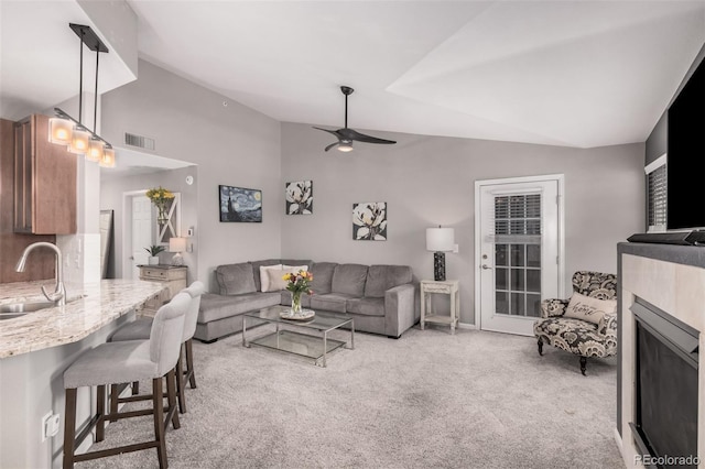 2955 Blue Sky Cir Unit 6-307, Erie, CO 80516 - living room featuring vaulted ceiling, carpet floors, and ceiling fan