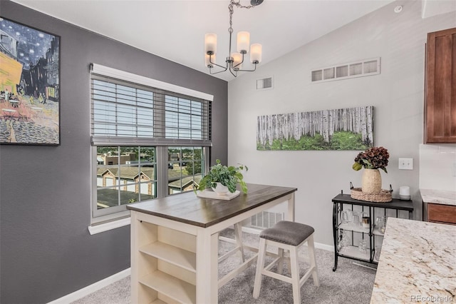2955 Blue Sky Cir Unit 6-307, Erie, CO 80516 - dining space featuring a chandelier, vaulted ceiling, and carpet floors