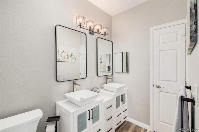 2955 Blue Sky Cir Unit 6-307, Erie, CO 80516 - bathroom featuring double vanity and wood finished floors
