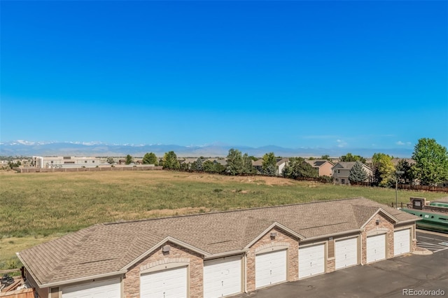 2955 Blue Sky Cir Unit 6-307, Erie, CO 80516 - exterior space featuring community garages and a mountain view