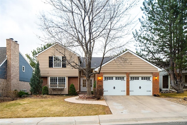 view of front of house with a garage, concrete driveway, brick siding, and a front lawn