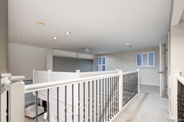 corridor featuring recessed lighting, carpet flooring, and baseboards