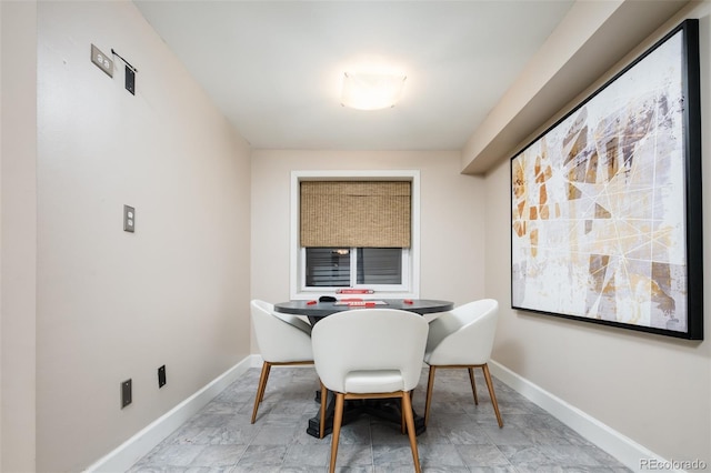 dining room with baseboards