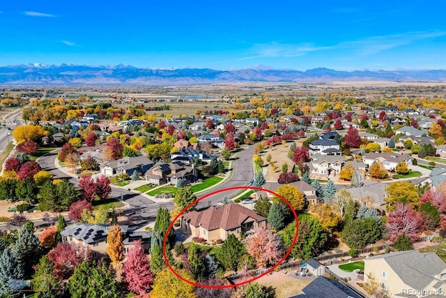 birds eye view of property featuring a mountain view