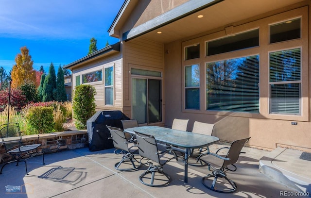 view of patio featuring a grill