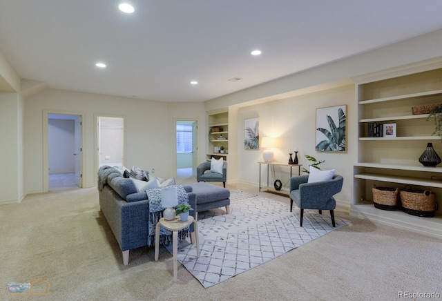 carpeted living room featuring built in features