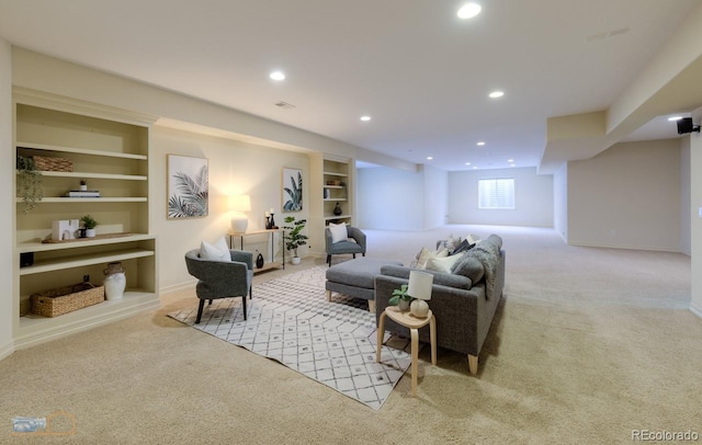 carpeted living room featuring built in shelves