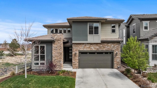 507 Red Thistle Dr, Highlands Ranch, CO 80126 - prairie-style home with driveway, stone siding, and a garage