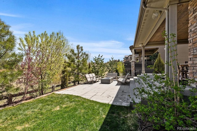 507 Red Thistle Dr, Highlands Ranch, CO 80126 - view of grassy yard featuring a patio and an outdoor living space with a fire pit