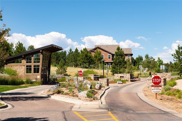 507 Red Thistle Dr, Highlands Ranch, CO 80126 - view of asphalt road with traffic signs and curbs
