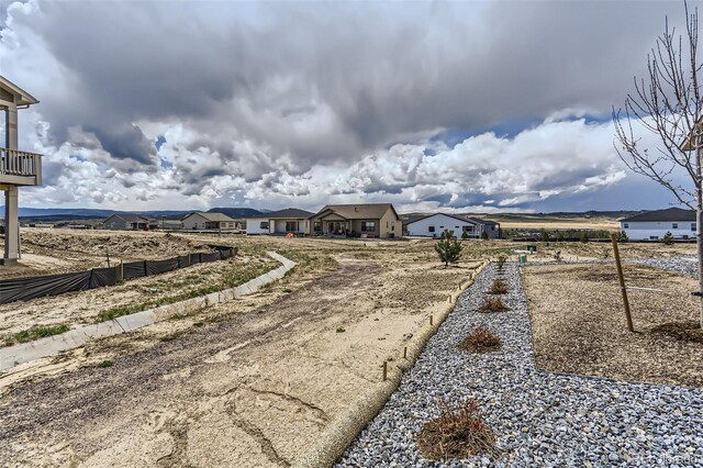 view of yard with fence and a residential view