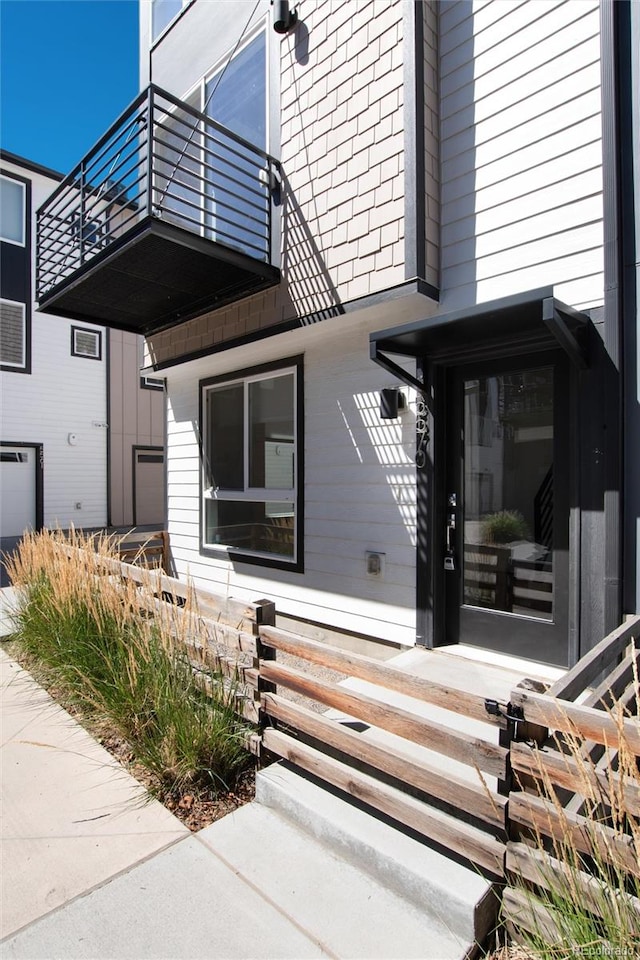 view of property exterior featuring a balcony