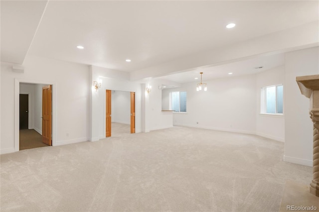 basement featuring recessed lighting, baseboards, and light carpet