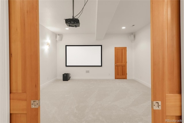 carpeted cinema with recessed lighting, beamed ceiling, and baseboards