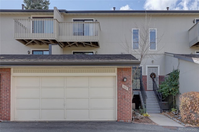 multi unit property featuring a garage