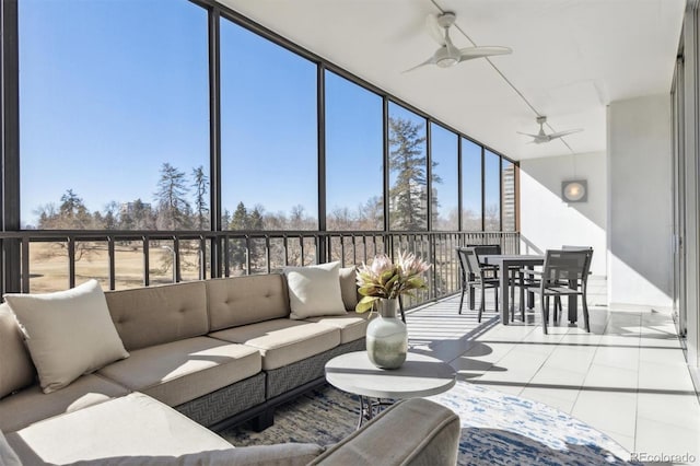 sunroom with a ceiling fan