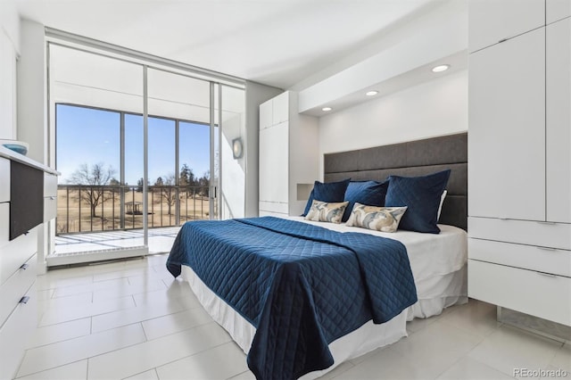 bedroom with light tile patterned floors, access to outside, expansive windows, and recessed lighting