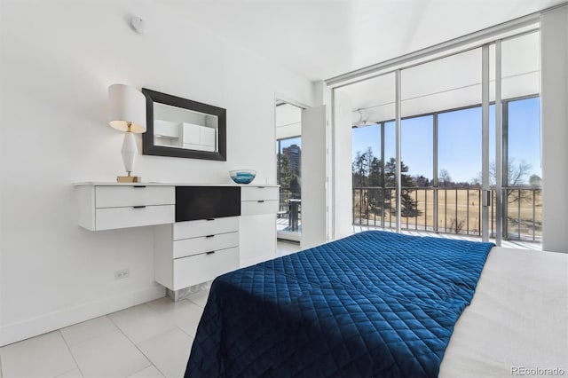 bedroom featuring access to exterior, baseboards, light tile patterned floors, and floor to ceiling windows