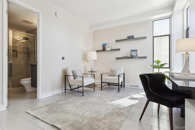 home office with baseboards, visible vents, and tile patterned floors