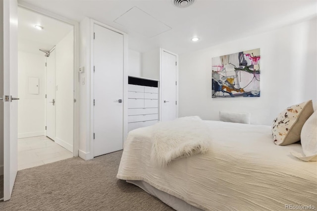 bedroom with attic access, visible vents, carpet flooring, and recessed lighting