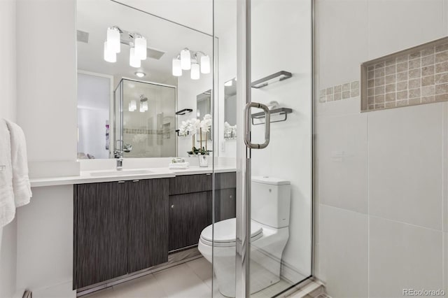 full bathroom featuring toilet, a shower stall, visible vents, and vanity