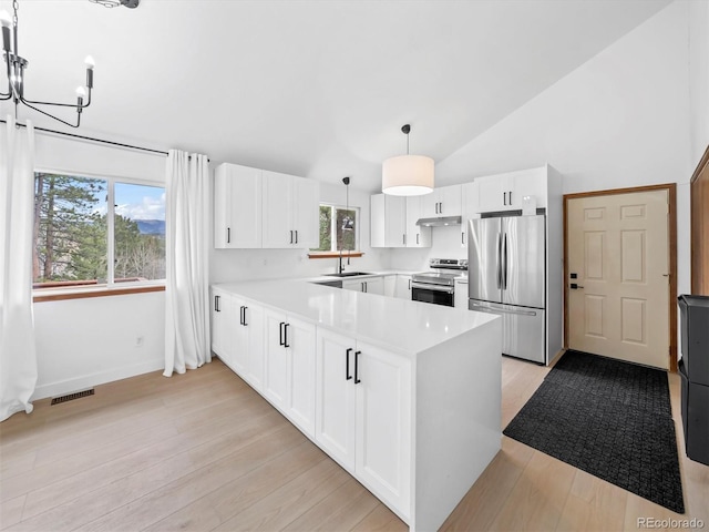 14 Aspen Dr, Bailey, CO 80421 - kitchen with appliances with stainless steel finishes, a sink, light countertops, a chandelier, and vaulted ceiling