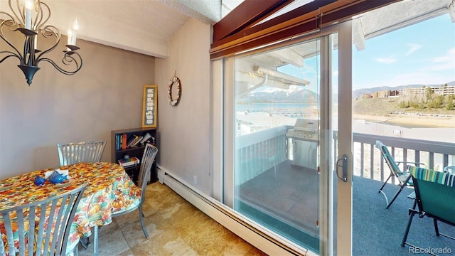 512 Tenderfoot St Unit 143, Dillon, CO 80435 - dining space with a chandelier and baseboard heating