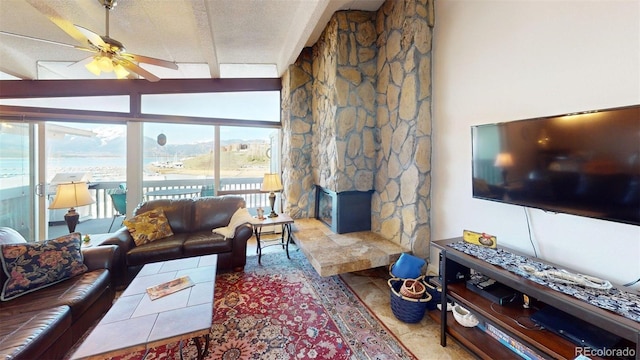 512 Tenderfoot St Unit 143, Dillon, CO 80435 - tiled living room with ceiling fan, lofted ceiling, and a textured ceiling