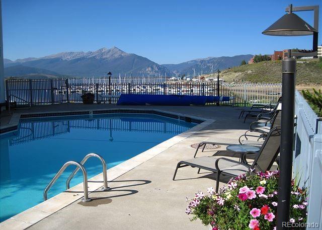 512 Tenderfoot St Unit 143, Dillon, CO 80435 - community pool with a mountain view and a patio area
