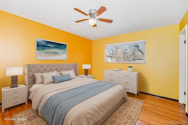 bedroom featuring a ceiling fan and light wood-style floors