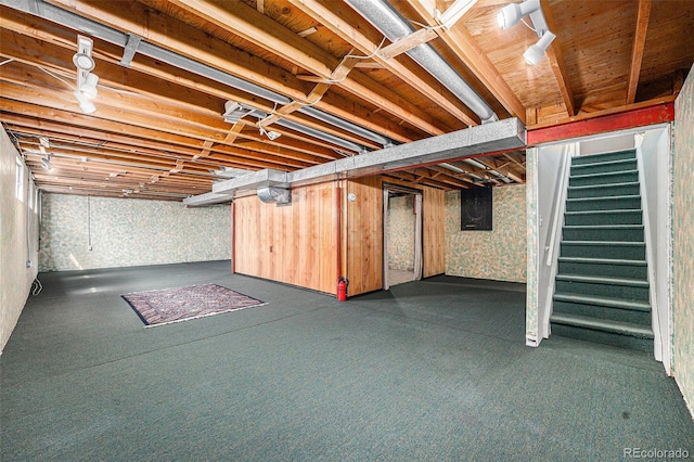 unfinished basement featuring stairs