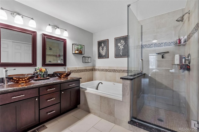 19935 E Stanford Dr, Centennial, CO 80015 - full bath featuring vanity, a garden tub, a stall shower, and tile patterned floors