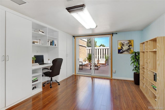 office area featuring hardwood / wood-style flooring and built in desk