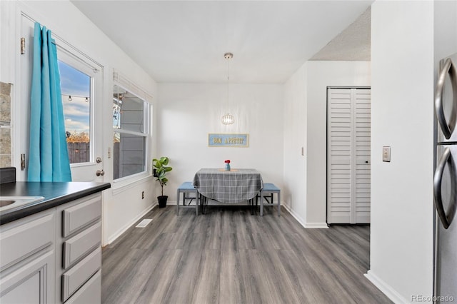 dining space featuring hardwood / wood-style flooring