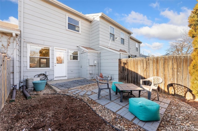 rear view of property featuring a patio