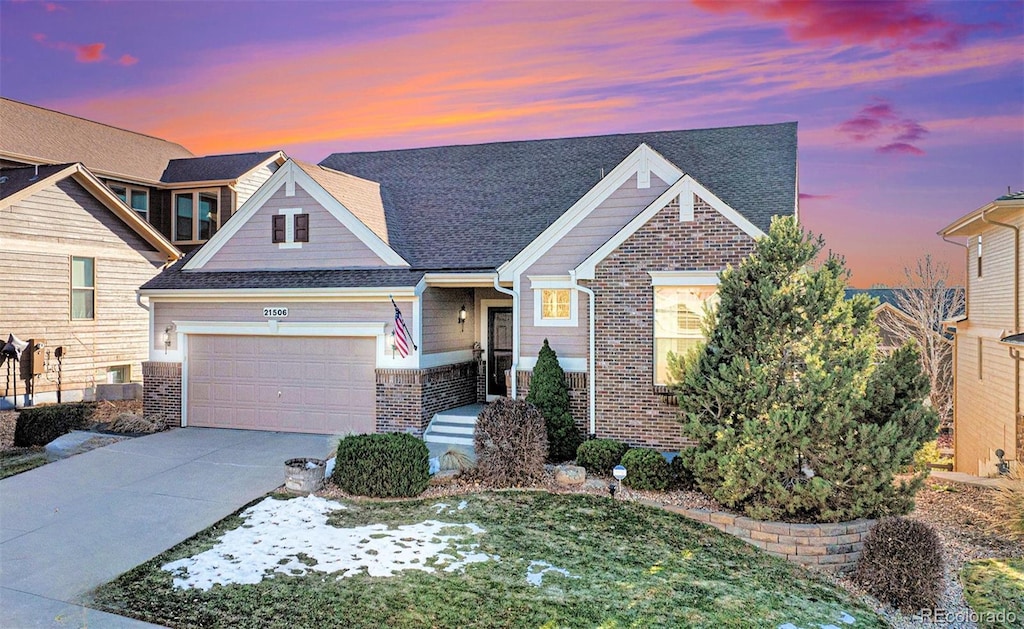 craftsman house featuring central AC unit and a garage