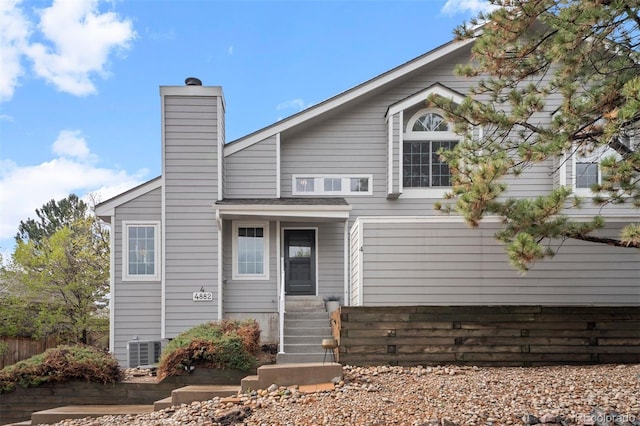 4882 W 68th Ave Unit 4, Westminster, CO 80030 - rear view of house featuring a chimney