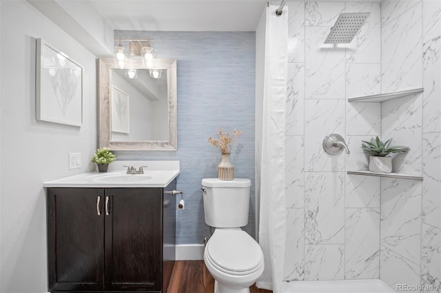4882 W 68th Ave Unit 4, Westminster, CO 80030 - full bath with vanity, toilet, a tile shower, and wood finished floors