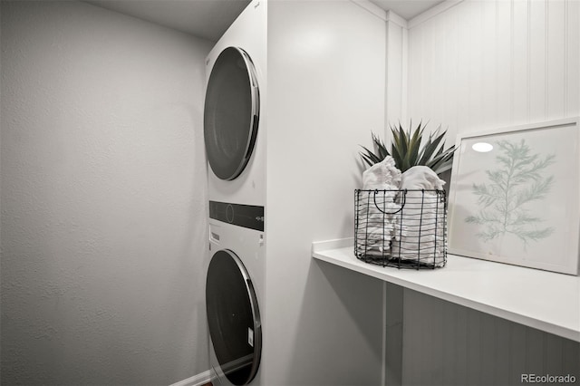 4882 W 68th Ave Unit 4, Westminster, CO 80030 - laundry area with stacked washer / dryer and baseboards