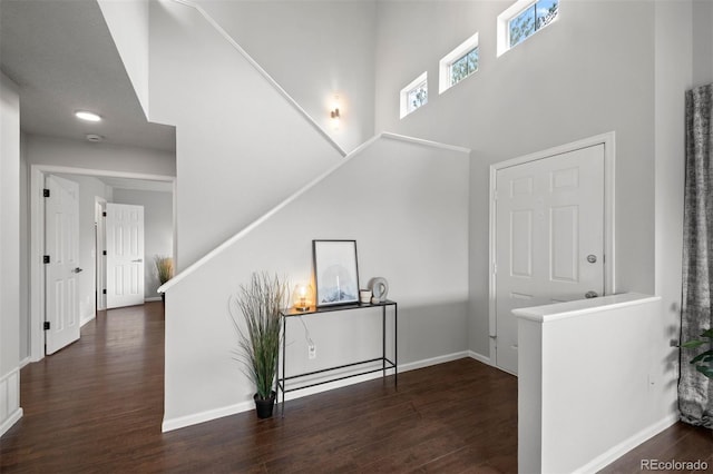 4882 W 68th Ave Unit 4, Westminster, CO 80030 - corridor with wood finished floors, a towering ceiling, and baseboards