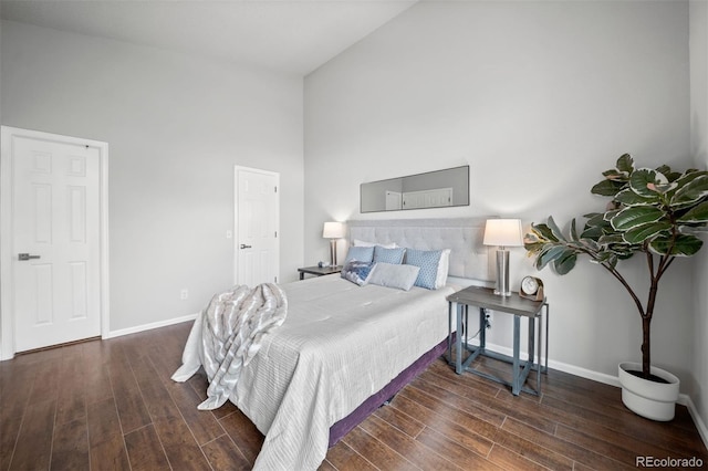 4882 W 68th Ave Unit 4, Westminster, CO 80030 - bedroom with wood finished floors, baseboards, and a towering ceiling