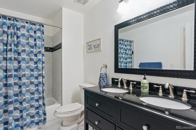 4750 S Dudley St Unit 21, Littleton, CO 80123 - bathroom with double vanity and shower / tub combo