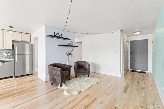 75 N Emerson St Unit 206, Denver, CO 80218 - living area with light wood-style floors and baseboards