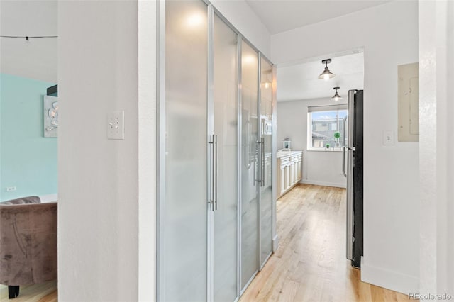 75 N Emerson St Unit 206, Denver, CO 80218 - corridor featuring light wood-style floors, french doors, electric panel, and baseboards