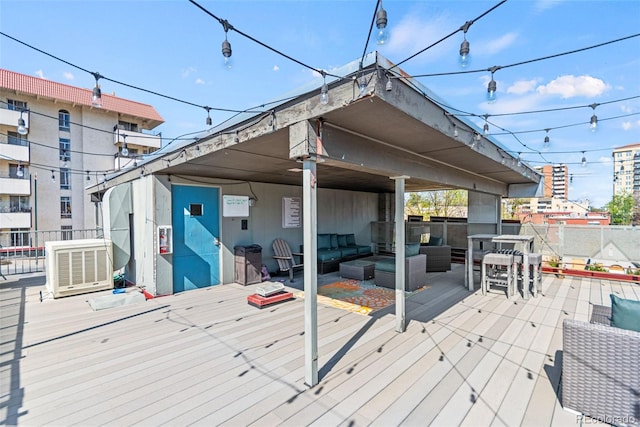 75 N Emerson St Unit 206, Denver, CO 80218 - wooden terrace featuring central AC unit, an outdoor hangout area, and fence