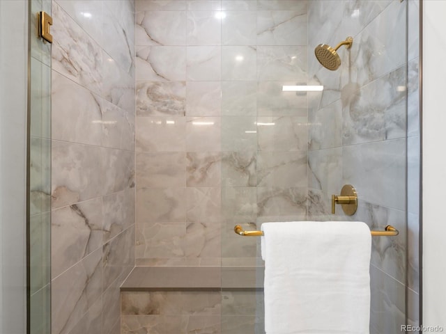 bathroom with a tile shower