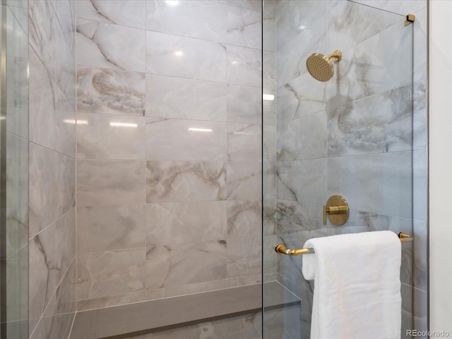 bathroom with tiled shower