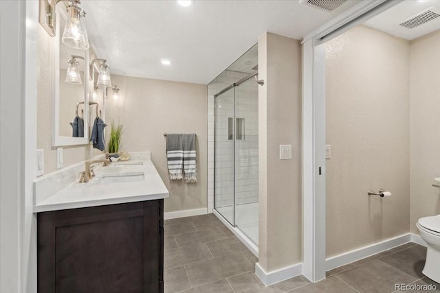 11840 Elkhorn Dr, Franktown, CO 80116 - full bathroom with toilet, vanity, a shower stall, tile patterned floors, and recessed lighting