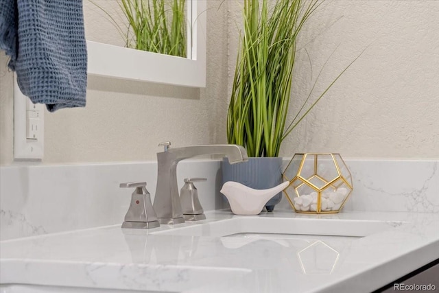 11840 Elkhorn Dr, Franktown, CO 80116 - bathroom view of a textured wall and vanity