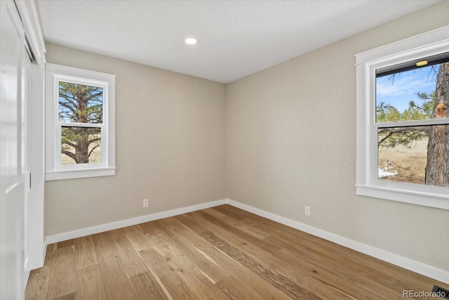 11840 Elkhorn Dr, Franktown, CO 80116 - unfurnished room with light wood-style floors, baseboards, and recessed lighting